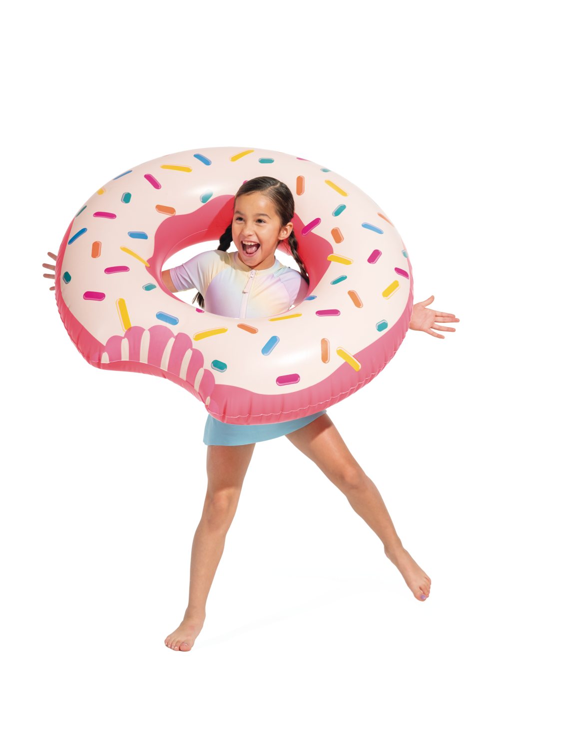 Inflatable rainbow donut swim tube with sprinkles, held by a child