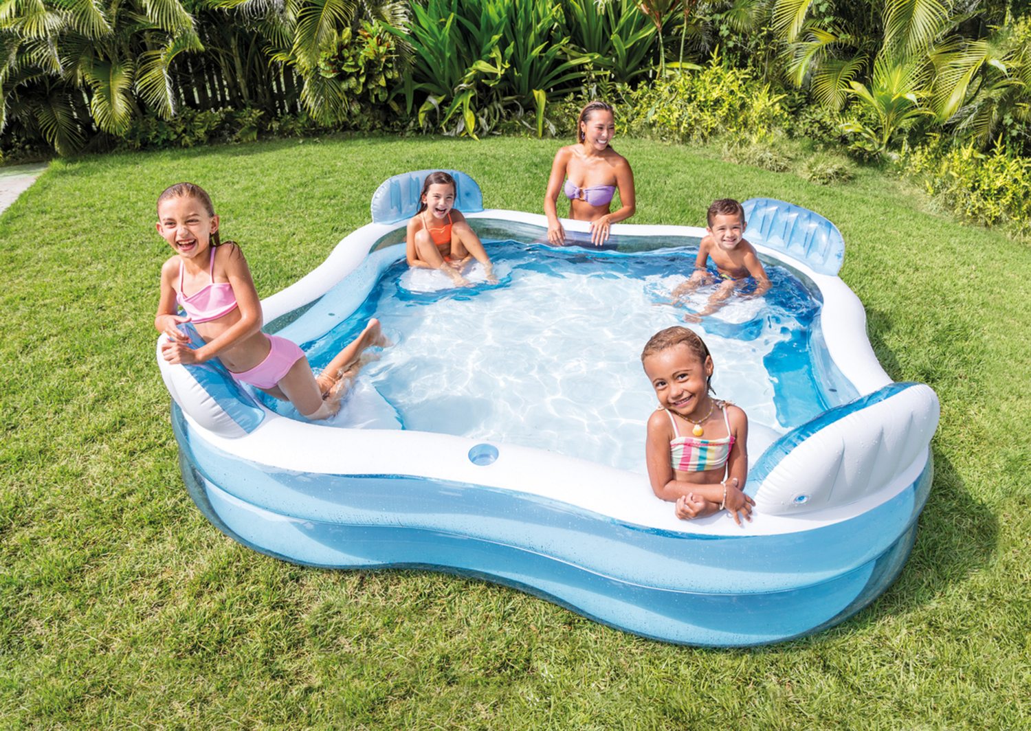 Inflatable family lounge pool with blue base, white interior, and molded headrests