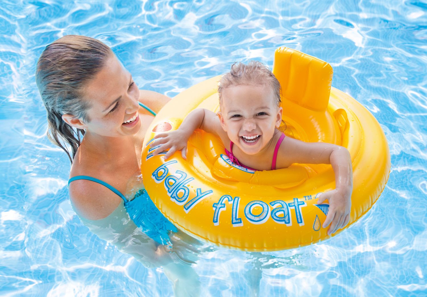Yellow inflatable baby float ring in the pool with My Baby Float branding