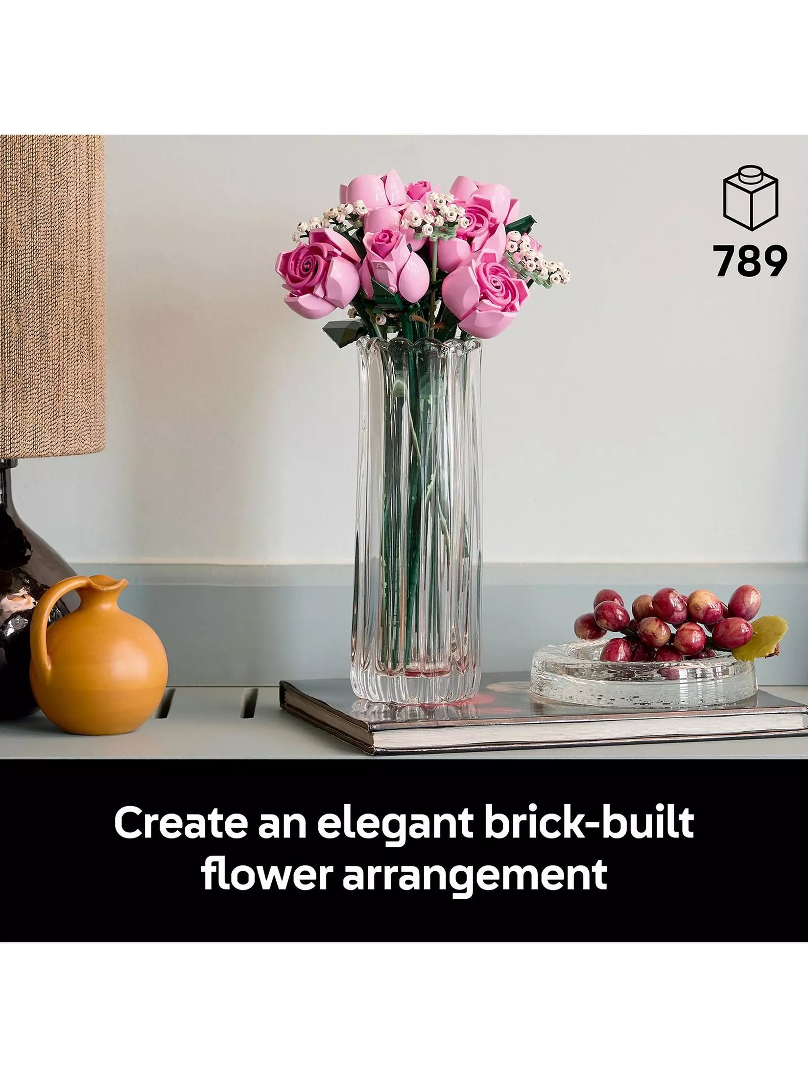 Pink LEGO rose bouquet in tall clear glass vase with green foliage