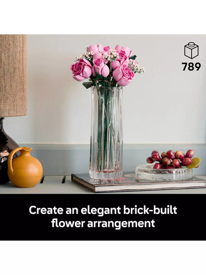 Pink LEGO rose bouquet in tall clear glass vase with green foliage