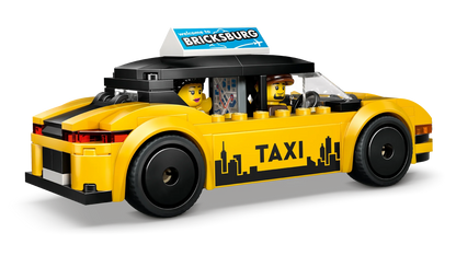 Yellow taxi toy car with BRICKSBURG roof sign, side view with two interior figures