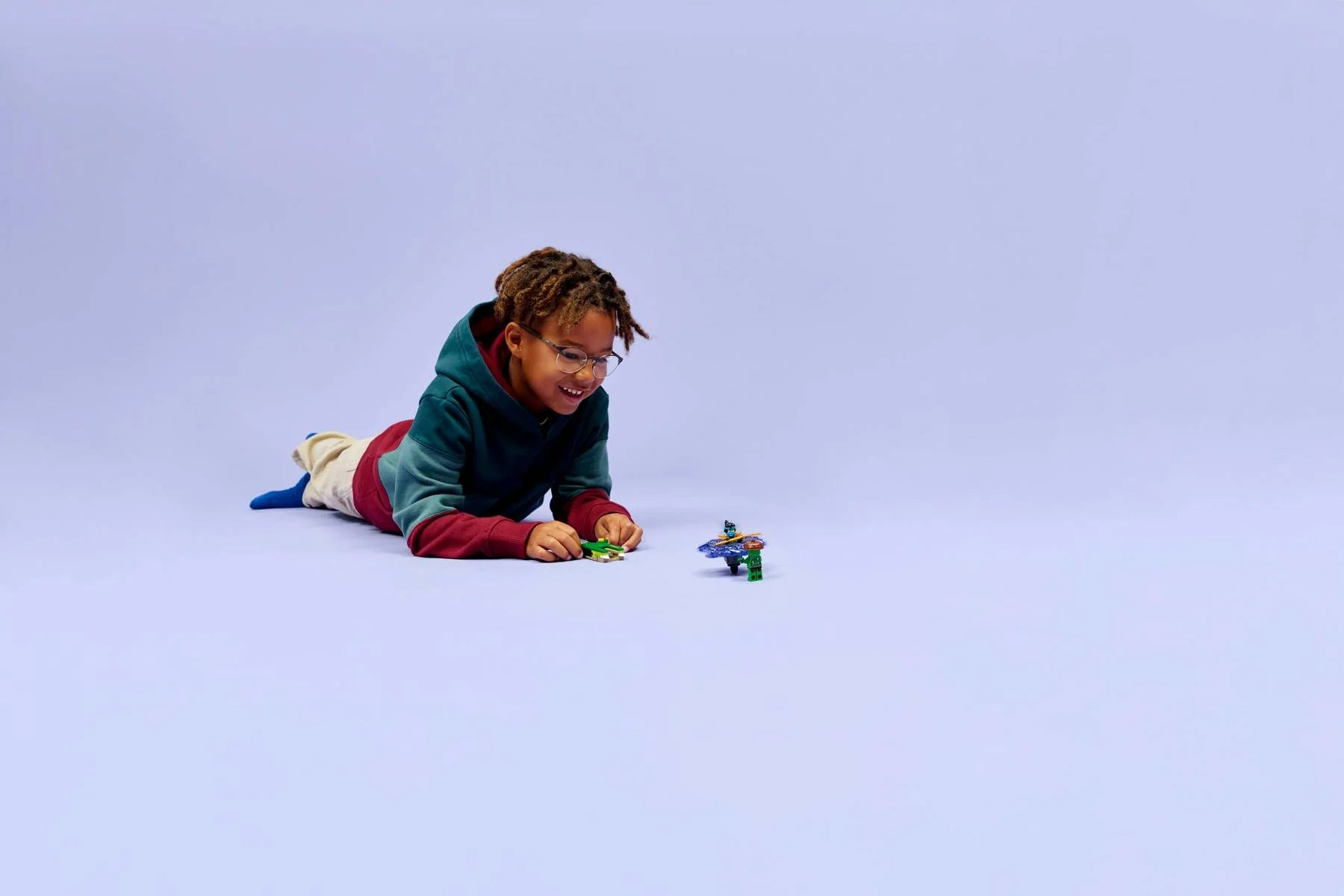 Child playing with Nya vs. Elemental Monster Spinner set