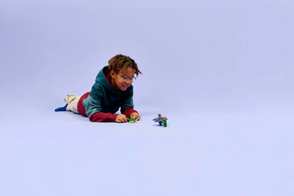 Child playing with Nya vs. Elemental Monster Spinner set