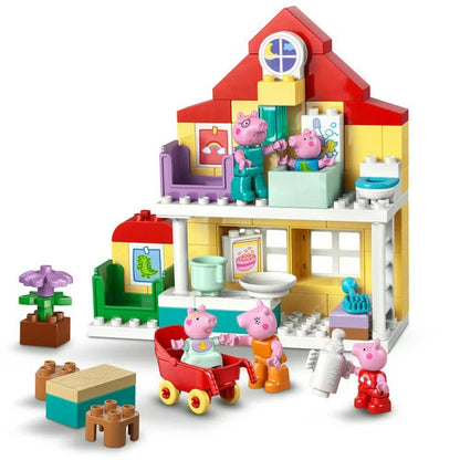 Assembled Peppa Pig house with red roof, kitchen and bathroom details, plus figures