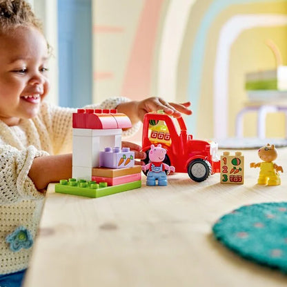 Tractor and market set: red toy tractor with market stall and Peppa figures