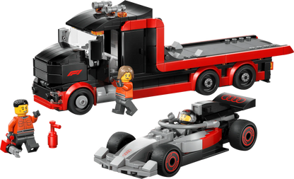 Red and black F1 display truck with gray race car on trailer and minifigure