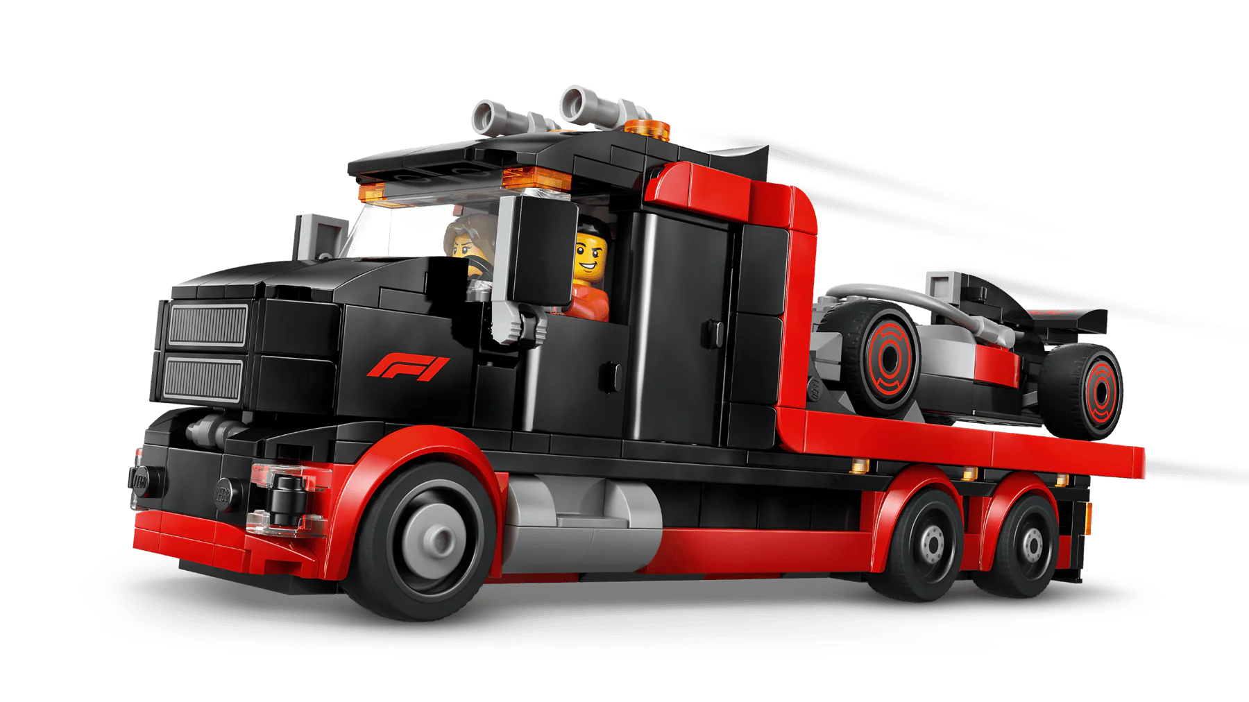Red and black F1 display truck with open cab, rear wheels and trailer frame