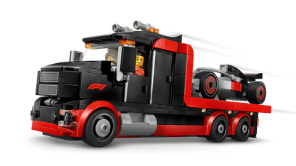 Red and black F1 display truck with open cab, rear wheels and trailer frame