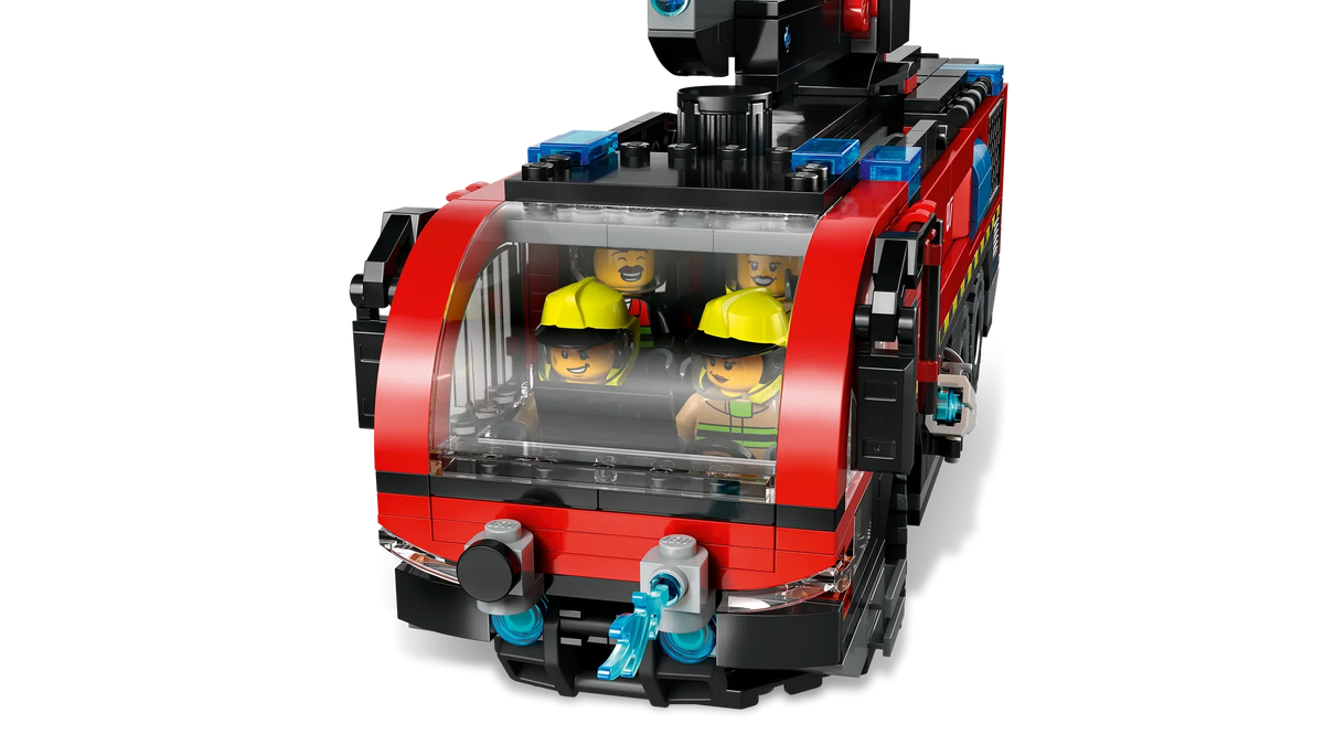 Red toy fire truck front cab with clear window and two yellow firefighter figures