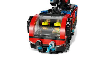 Red toy fire truck front cab with clear window and two yellow firefighter figures