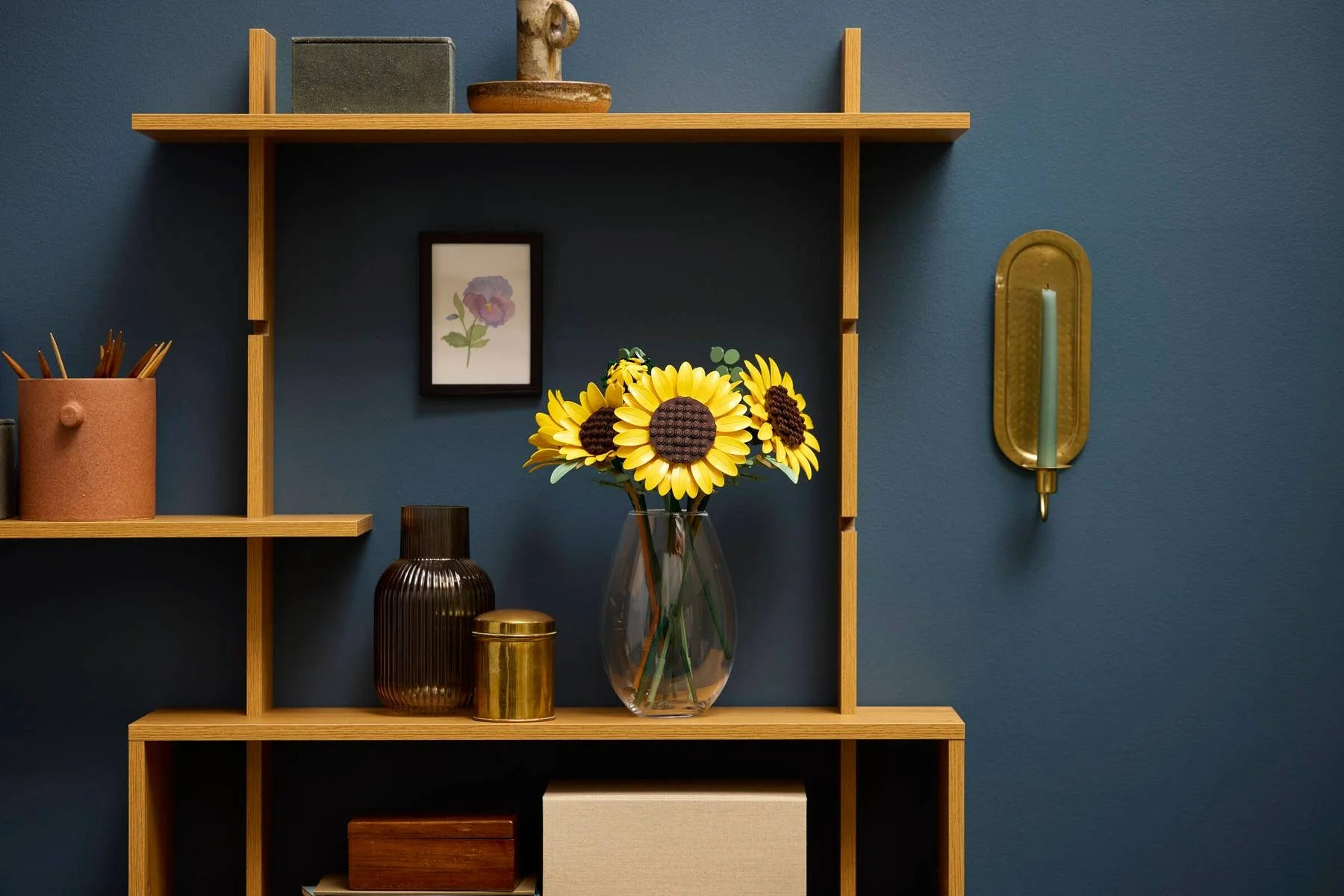 Sunflower bouquet in clear vase with yellow petals and dark brown centers