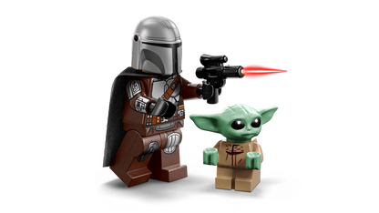 Mandalorian minifigure and Grogu with red blaster beam, close-up