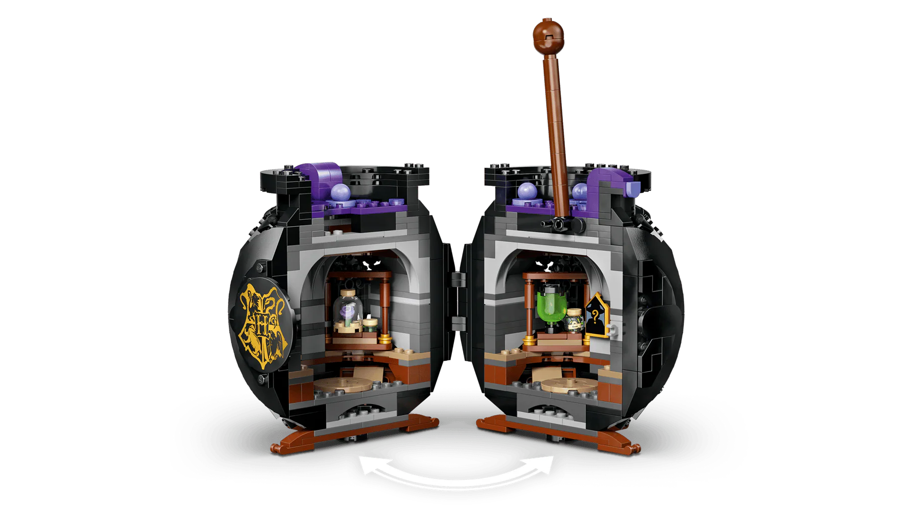 Cauldron playset with open double compartments, purple accents, potion bottles inside