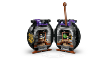 Cauldron playset with open double compartments, purple accents, potion bottles inside