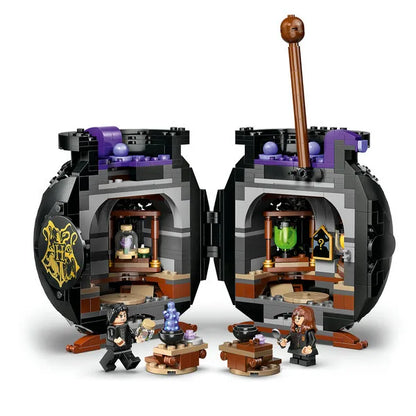 LEGO cauldron playset with open compartments, potion details, and two minifigures