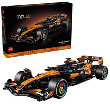 LEGO Technic race car model box and assembled orange-and-black car with front wheels