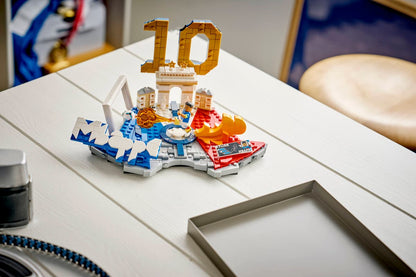 Soccer highlight display with gold "10" and a colorful stadium-style base
