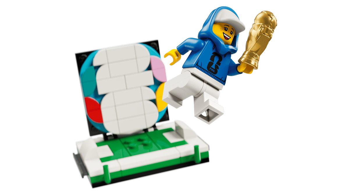 LEGO FIFA World Cup trophy build with blue-suited minifigure figure and spare bricks