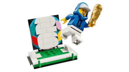 LEGO FIFA World Cup trophy build with blue-suited minifigure figure and spare bricks