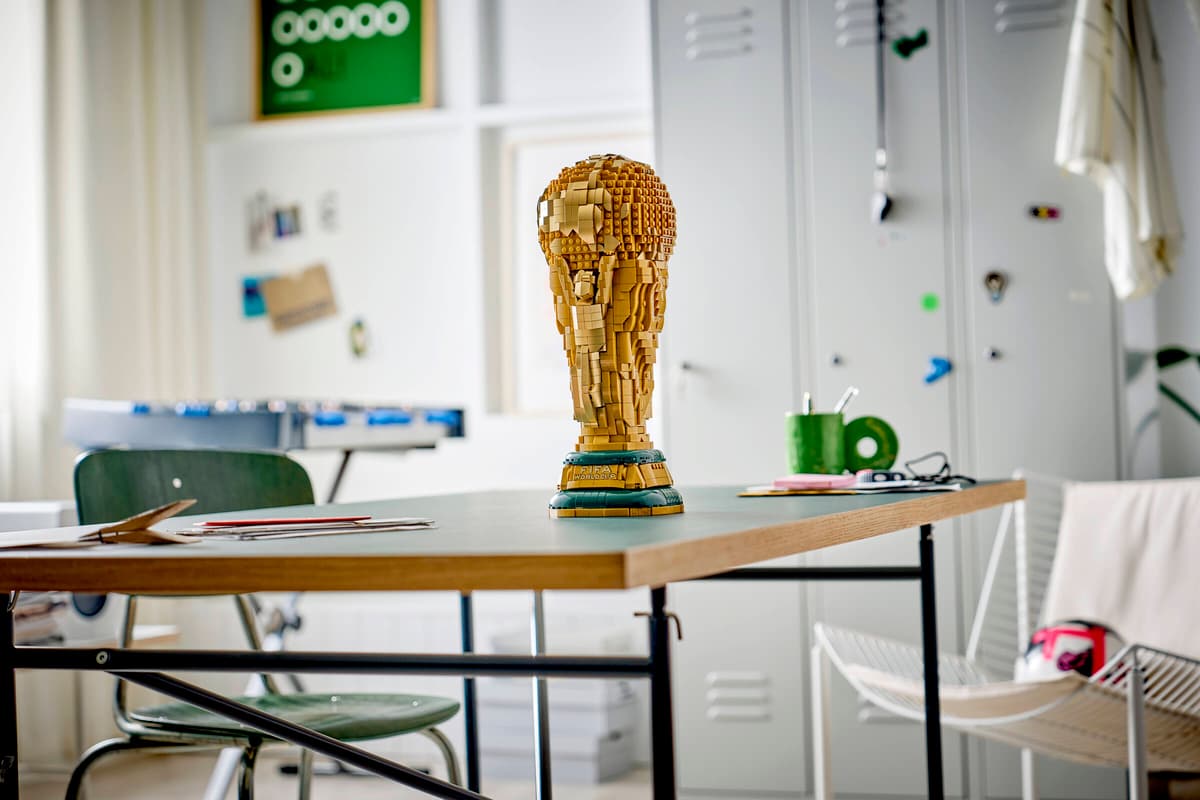 LEGO FIFA World Cup trophy brick model standing on a desk in a classroom
