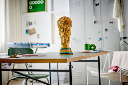 LEGO FIFA World Cup trophy brick model standing on a desk in a classroom