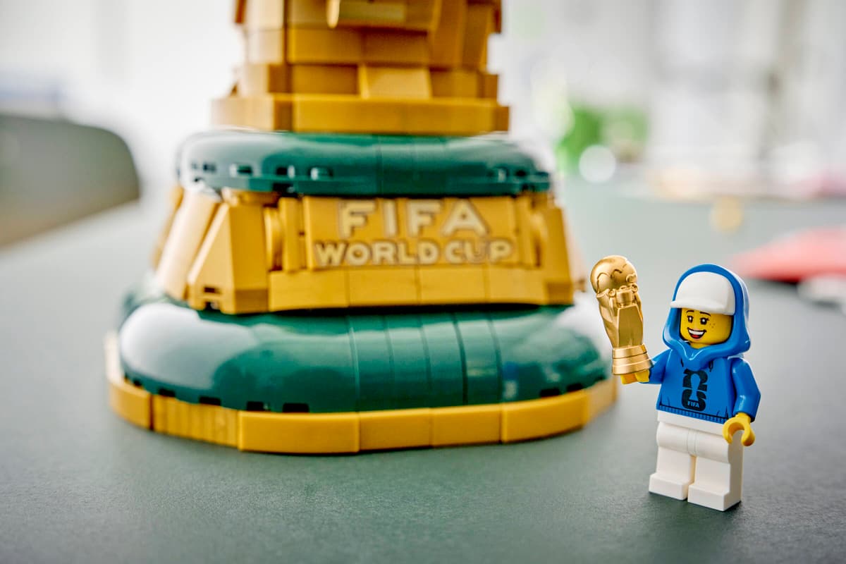 LEGO FIFA World Cup trophy green base with a small LEGO figure next to it