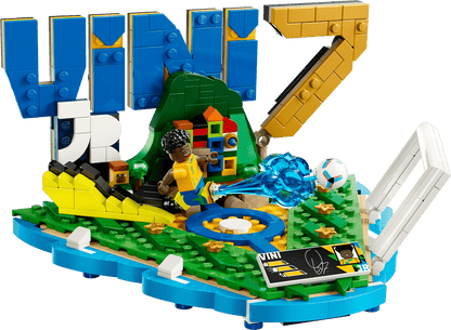 LEGO soccer highlights base with green turf, blue details, ball and minifigure