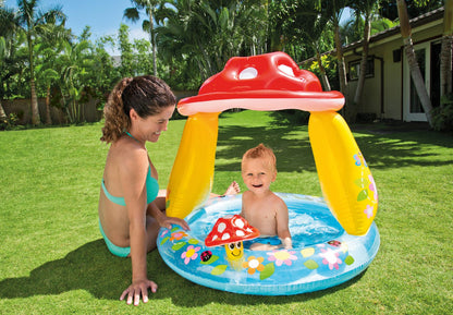 Inflatable mushroom baby pool with red top, yellow sides, and blue floor ring
