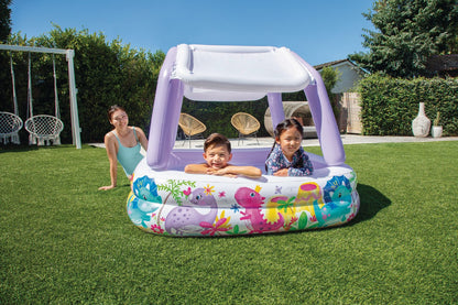 Inflatable kids pool with white canopy and lavender support poles, sea-animal graphic
