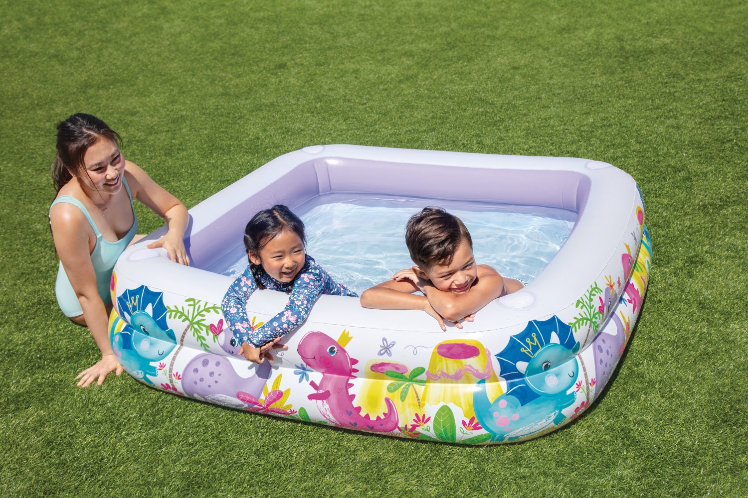 Inflatable kids pool with white interior and lavender side supports, marine animal print