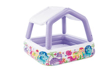 Inflatable kids pool with purple frame and white sun canopy, colorful dinosaur print