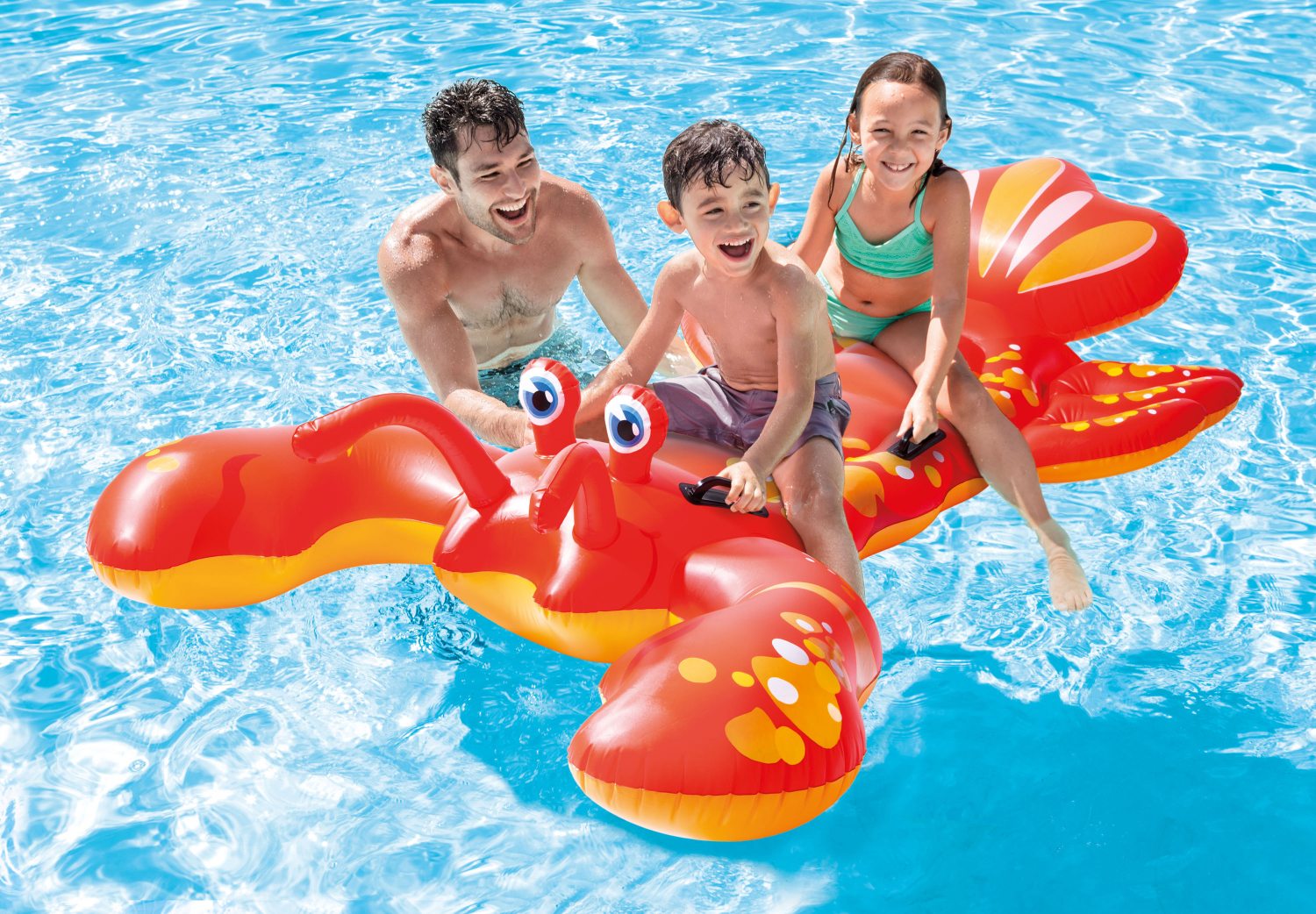 Inflatable lobster ride-on in pool, with yellow-orange claws and big eyes
