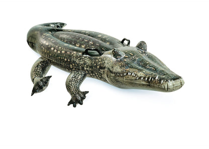 Gator ride-on toy with green scaly skin, open mouth, and black handle