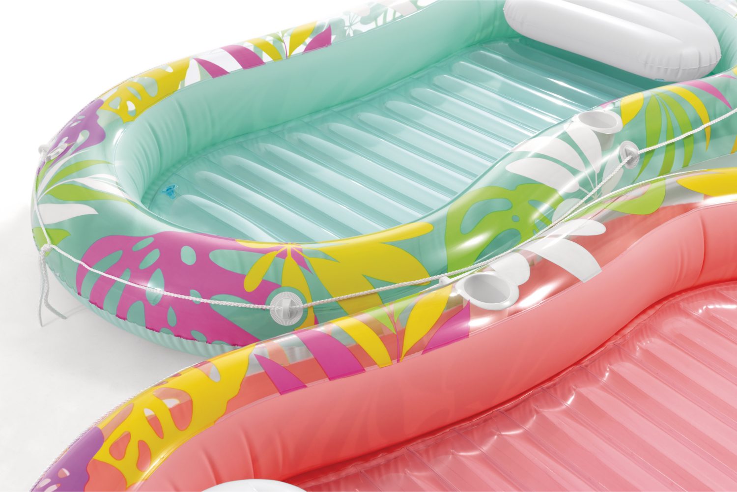 Inflatable tropical lounger with mint base, ribbed seat, and attached cup holders
