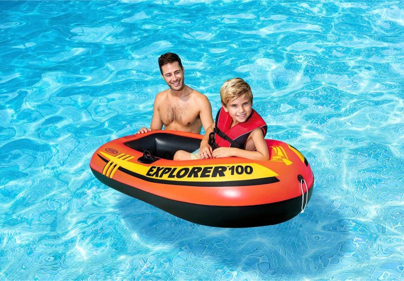 Explorer 100 inflatable boat with two riders seated on the orange deck