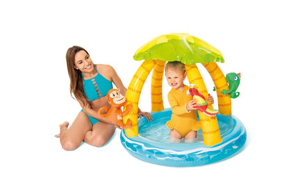 Tropical island baby pool with green canopy, blue base, and under-canopy animal toys