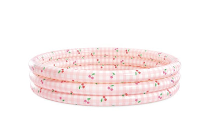 Inflatable kiddie pool with pink gingham and cherry print, side view
