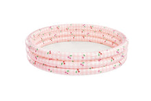 Inflatable kiddie pool with pink gingham and cherry print, rounded ring design