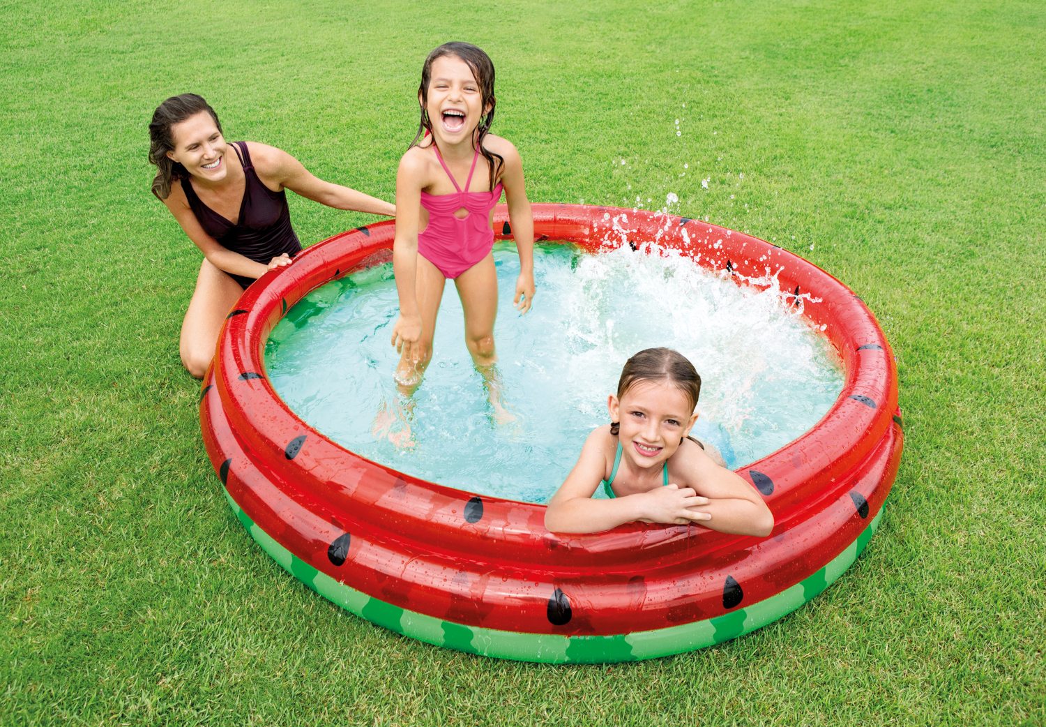 Inflatable watermelon pool with red rim and green floor, black seed graphic