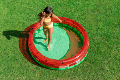 Watermelon pool with red-and-green inflatable walls and black seed dots, round