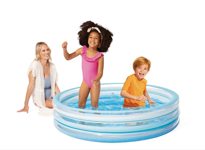 Inflatable splash pool with blue rim in use by children
