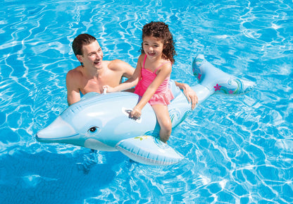 Inflatable dolphin ride-on in pool with a child seated on top