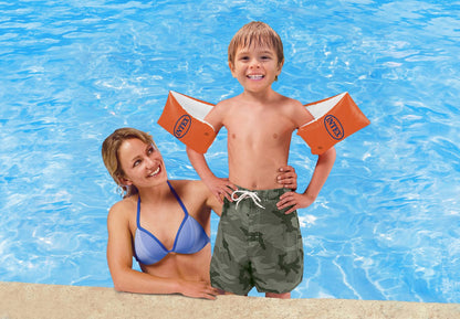 Orange inflatable arm bands on arms, INTEX logo visible on both sides