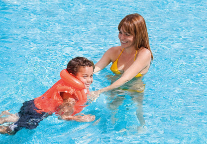 Orange swim vest worn by a child in water, front buckles visible