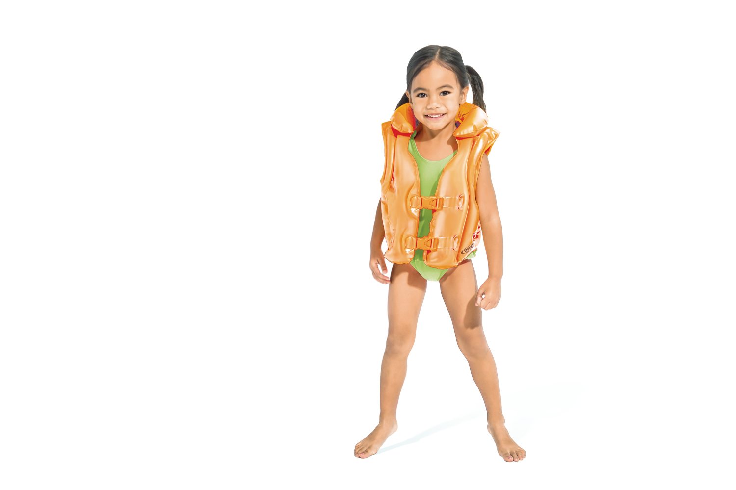 Orange swim vest with front straps and buckles on a standing child