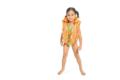 Orange swim vest with front straps and buckles on a standing child