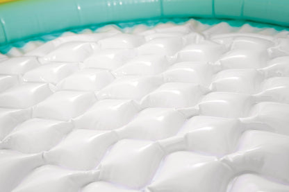 White inflatable baby pool floor with raised diamond-pattern bumps