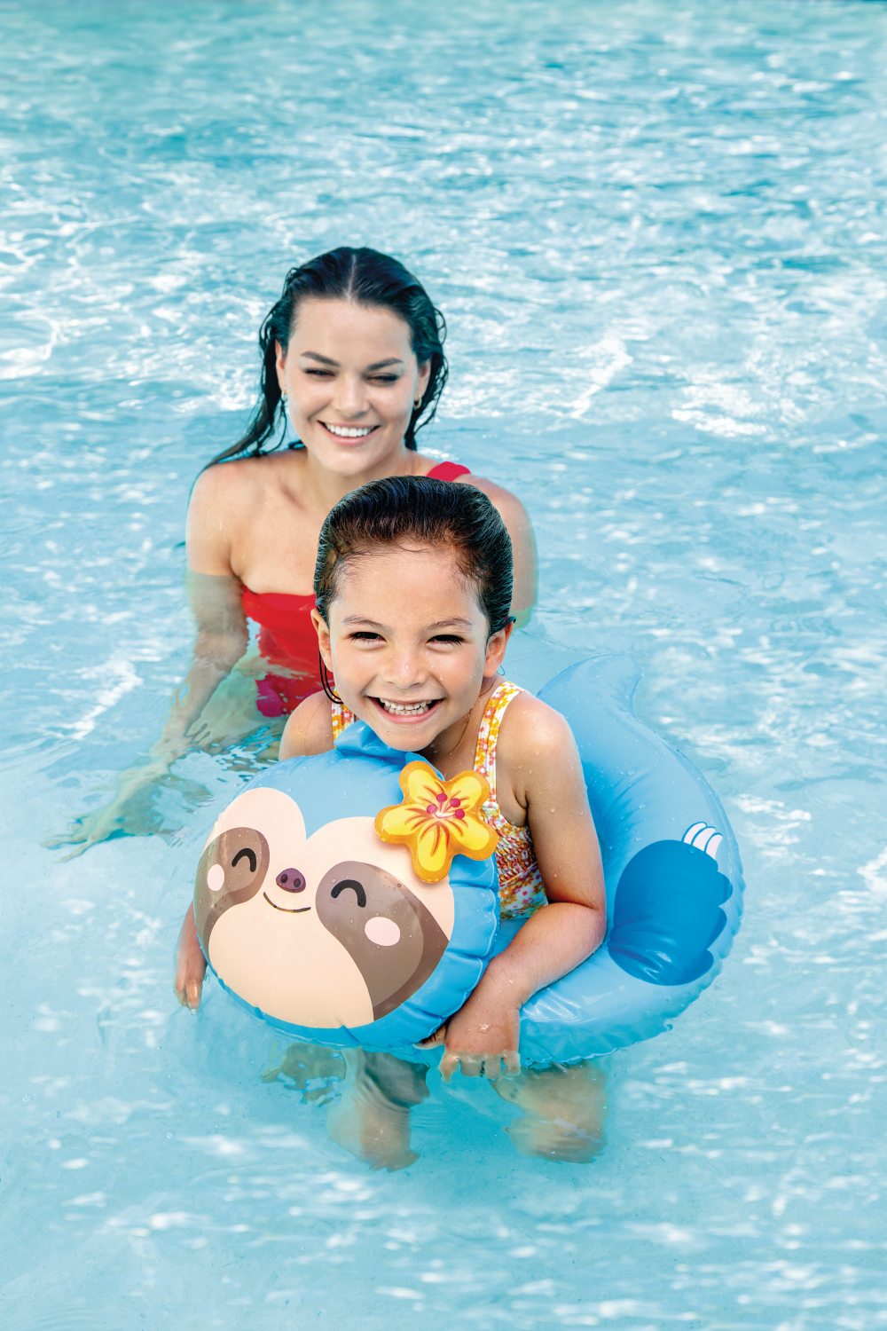 Blue animal inflatable swim ring with bear face, used in pool by child