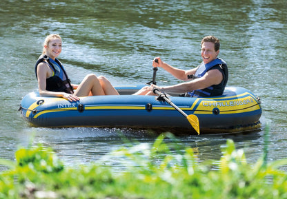 Yellow-blade paddle oars with black shafts on an inflatable boat.